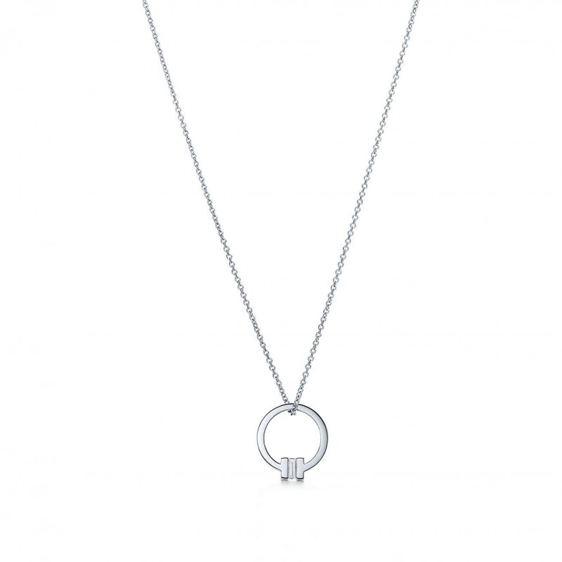 TIFFANY T PENDANT IN 18K WHITE GOLD WITH A BAGUETTE DIAMOND